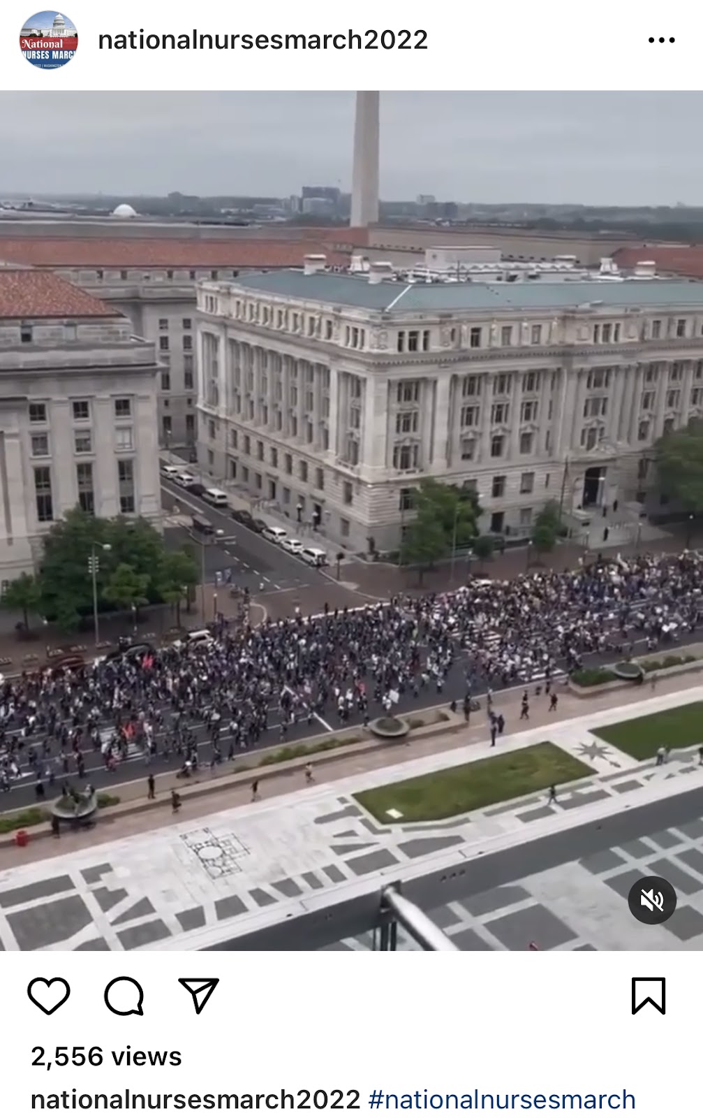 Several marchers on a crowded steet.