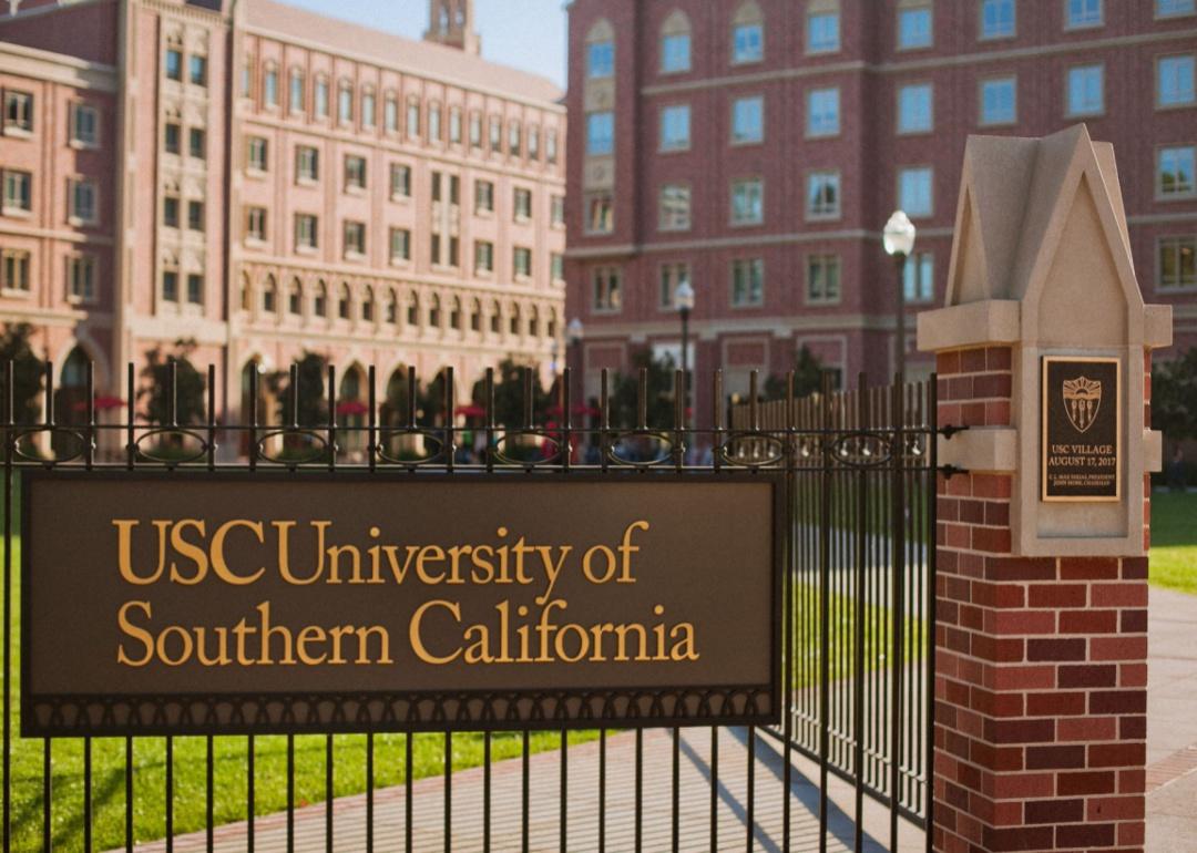 An iron gate with the University of Southern California sign.