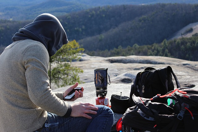 a man with all his Camping hiking and backpacking gear