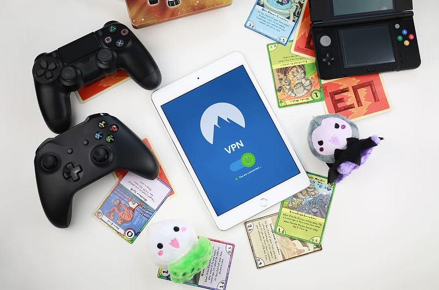 a tablet, several game joysticks and cards with game plots