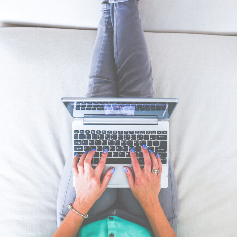 woman typing on laptop