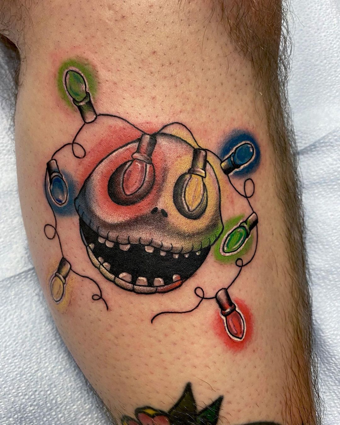 Unsettling Christmas Lights Tattoo