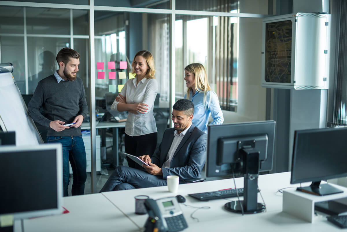 Group of employees talking to each other