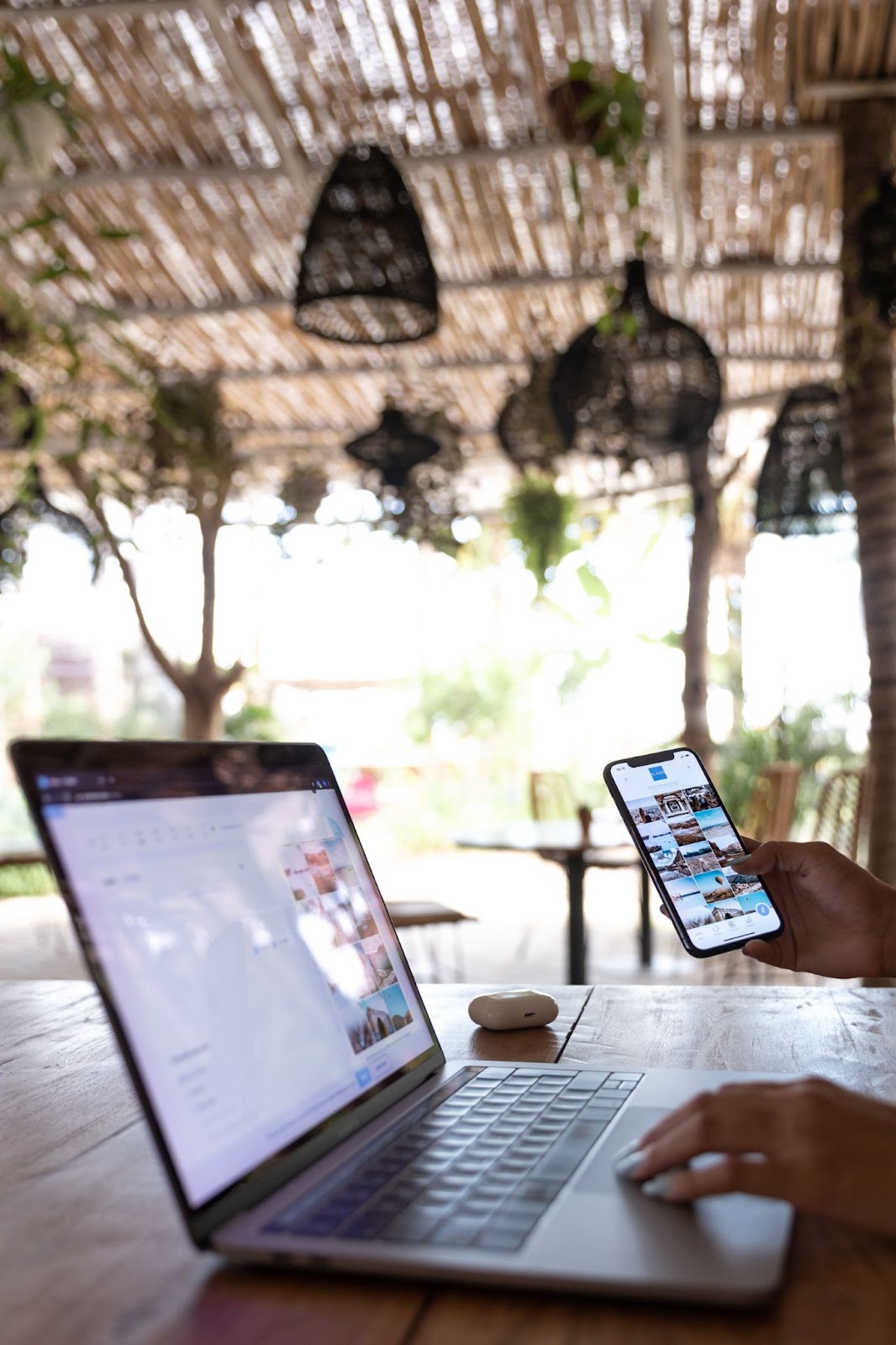 a woman using a laptop and smartphone  