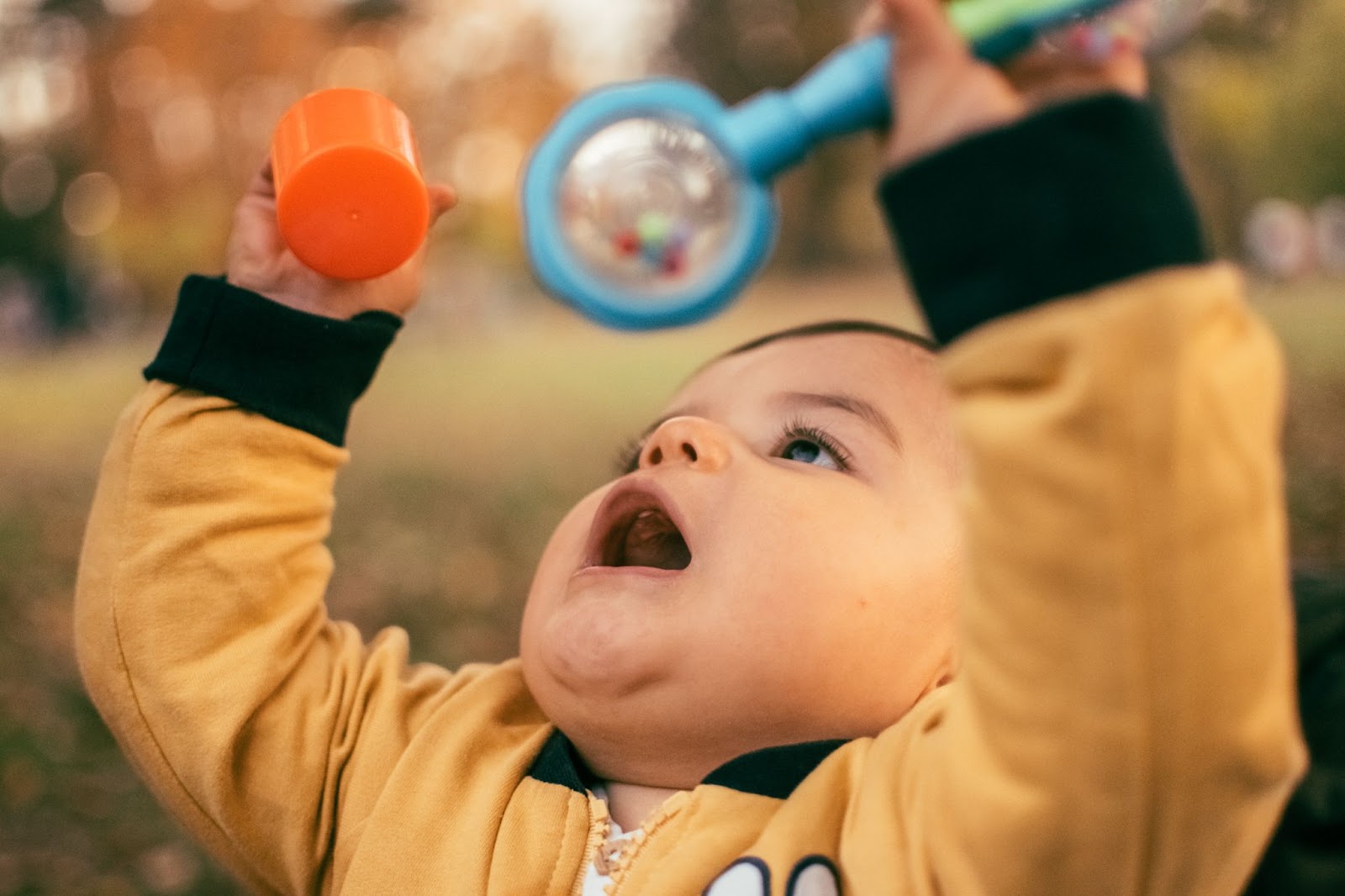 Baby playing with a Rattle.