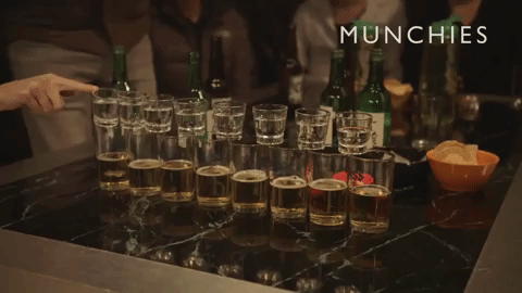 small glasses of soju fall into big glassses of beer