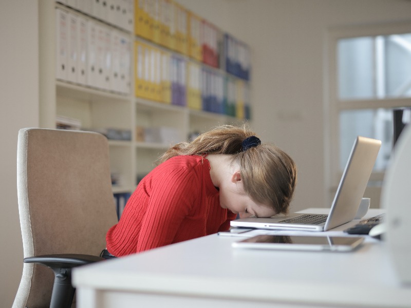 Employee seemingly frustrated at the office.