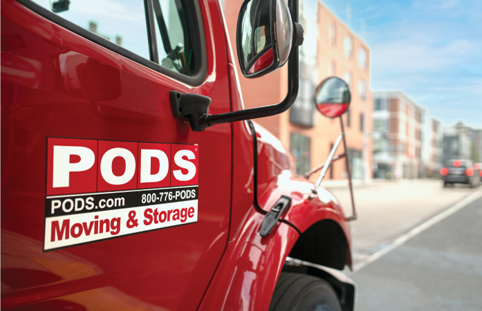 A PODS moving & storage truck being used for condo moving