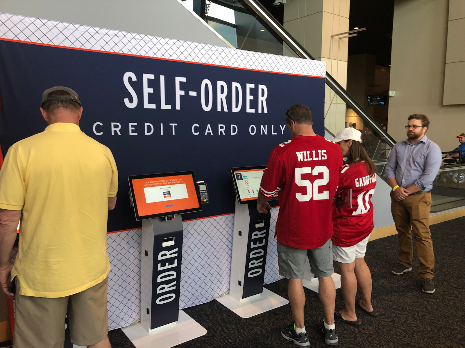 SpotOn self service kiosks in action at a football game.