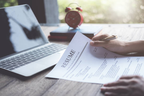 a person looking at a resume
