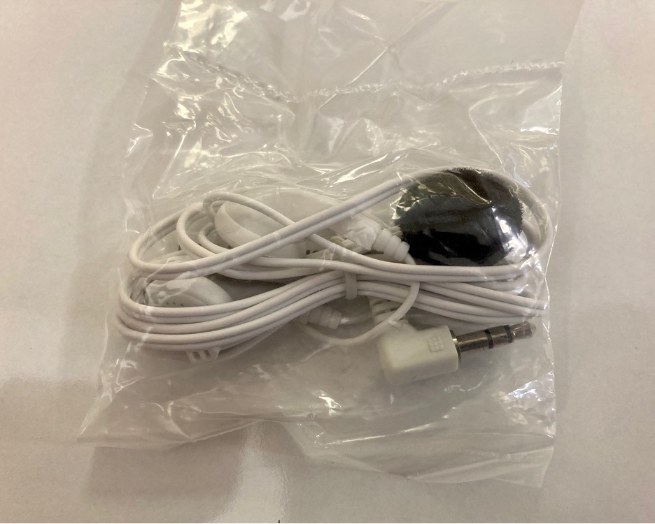 packet of white headphones
