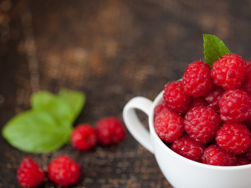 mug filled with raspberries