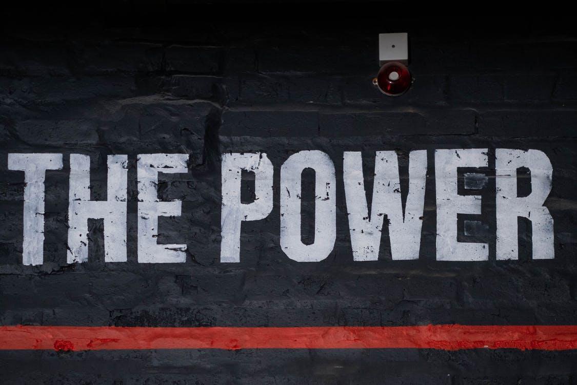 The Power Text Sign on a Wall