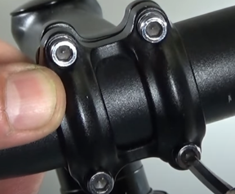 The faceplate needs to be removed so that the stem can be flipped to adjust the mountain bike handlebar height.