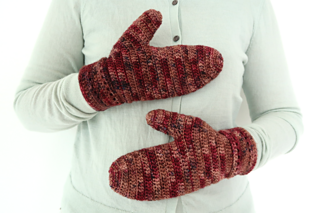 a hands wearing fireside mittens