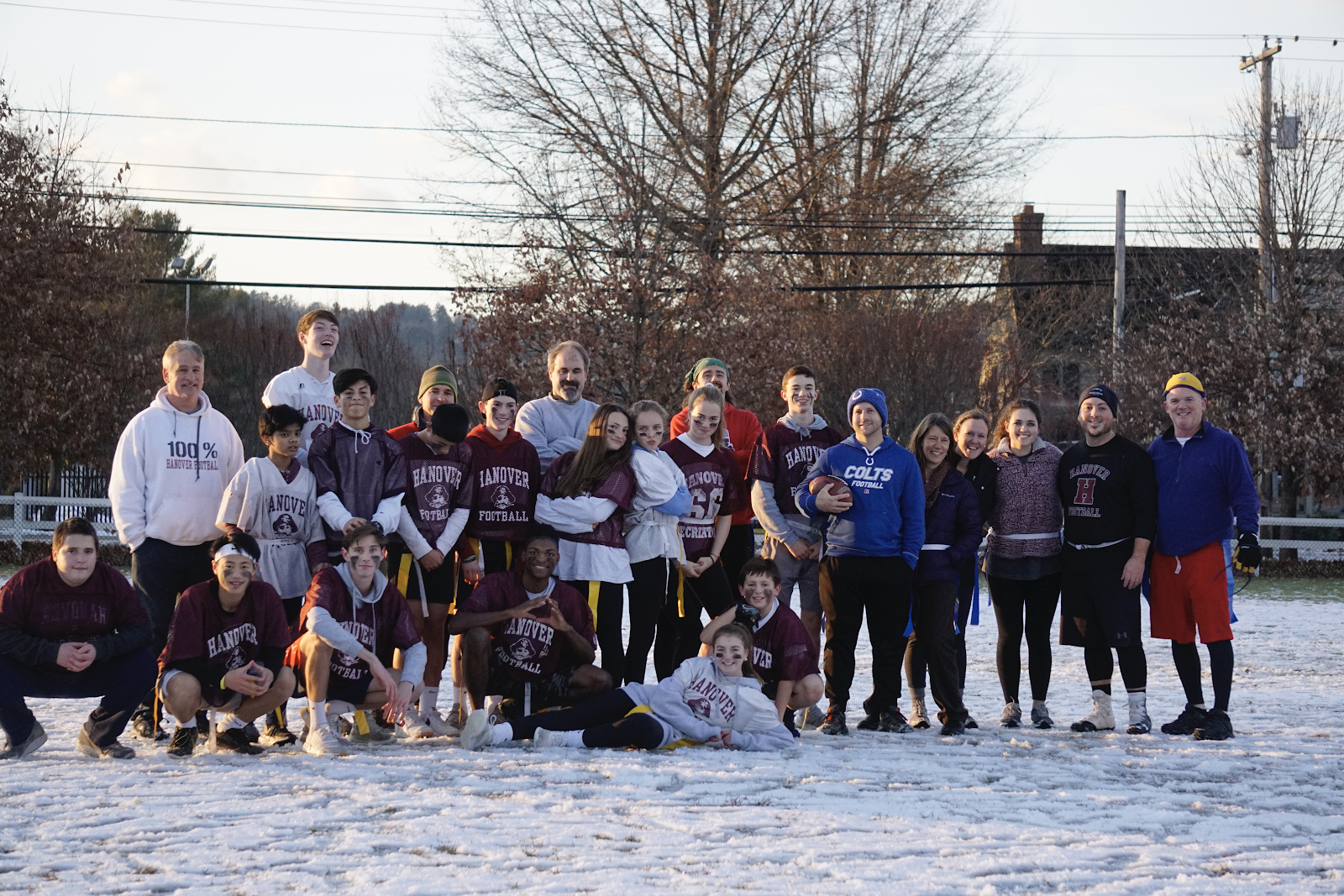 students outside on the snow covered field after Turkey Bowl