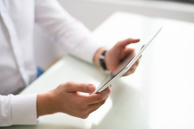 A close-up of a student engrossed in searching med school interview questions and answers on a tablet.