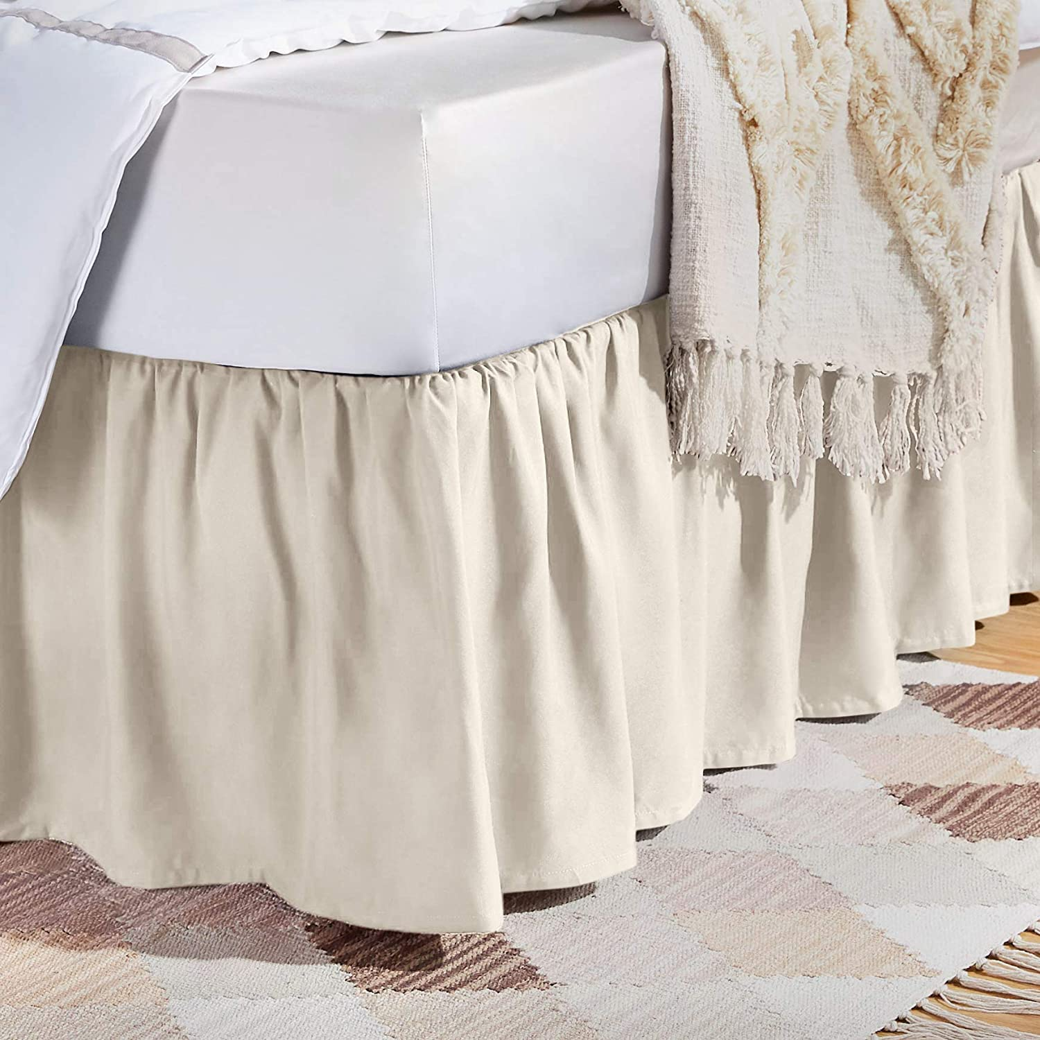 A bed skirt vs. dust ruffle are the same thing. Here is a ruffled bed skirt or dust ruffle covering the side of a bed.