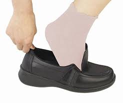 Picture of a person trying to wear Slip On Shoes 