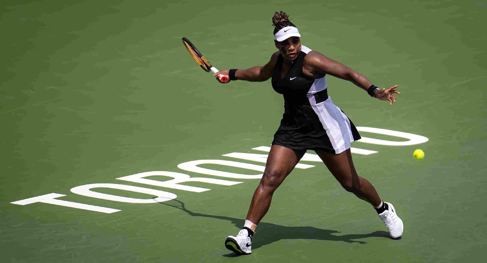 A person playing tennis on a court

Description automatically generated