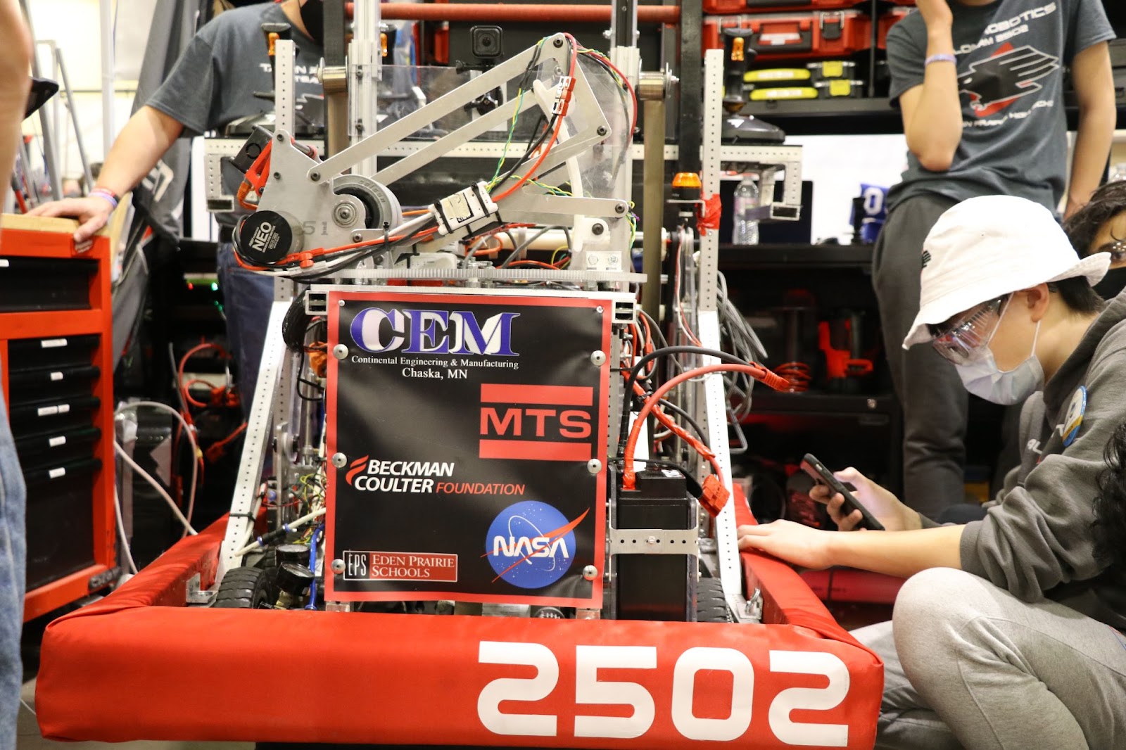 The robot in our pit next to the team captain. 