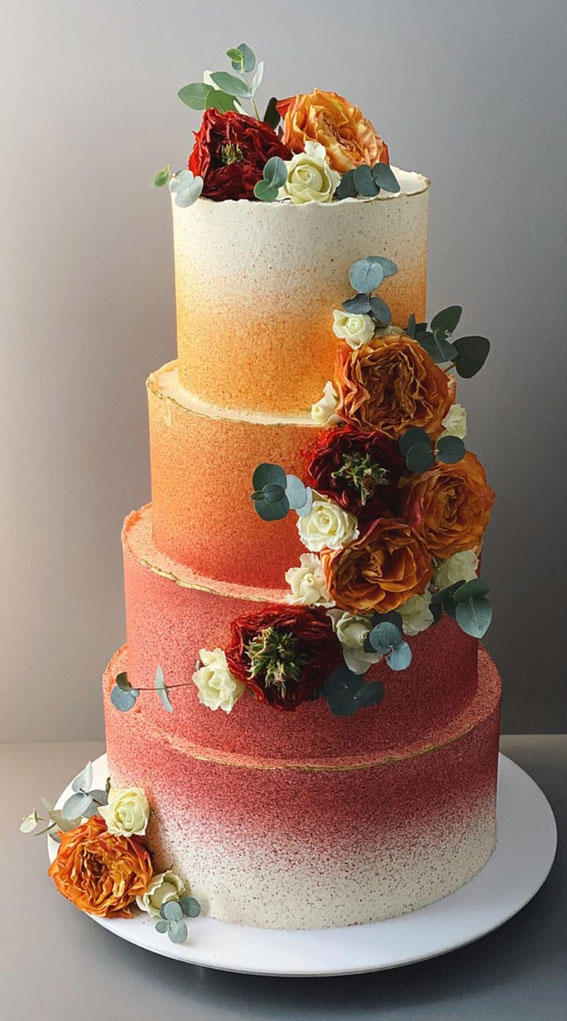 photo of ombre orange wedding cake