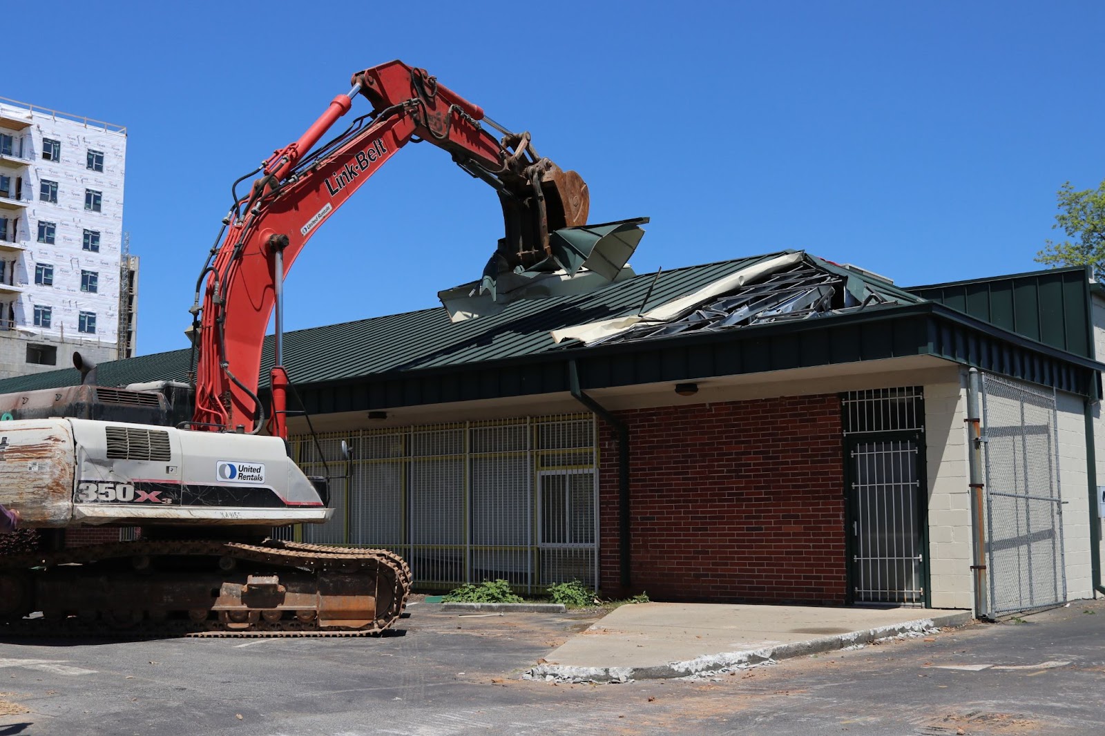 Excavator ripping through the old Atlanta Day Shelter during construction as Atlanta Mission prepared for the new shelter for women and children 