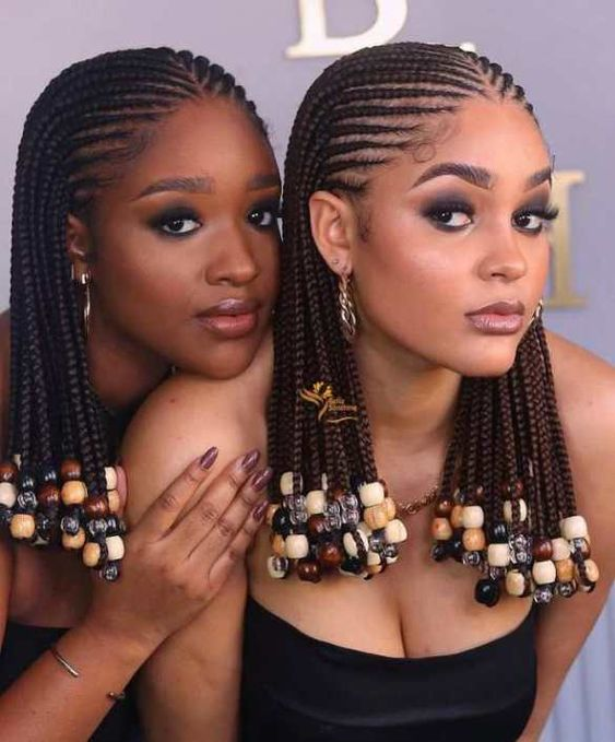 two ladies rocking short cornrows with beads