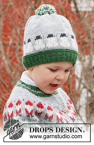toddler wearing a hat with intarsia snowmen