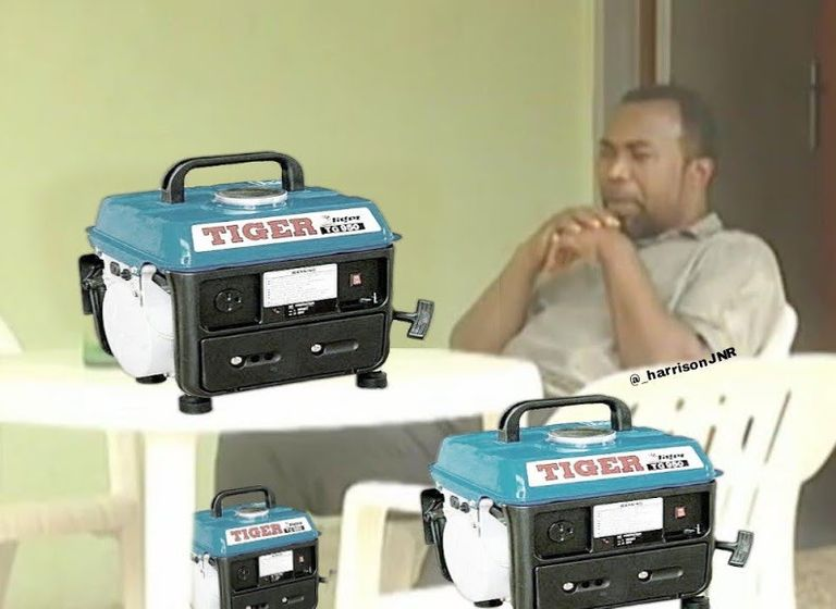 Zack Orji sitting on a white plastic furniture with small tiger generators photoshopped on the table and around him