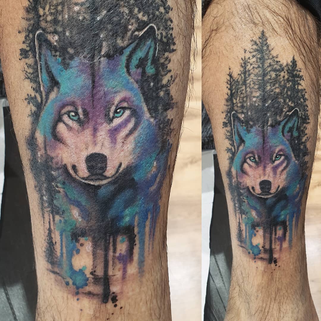 Colorful Norse Tattoo With Blue Wolf Design On Leg