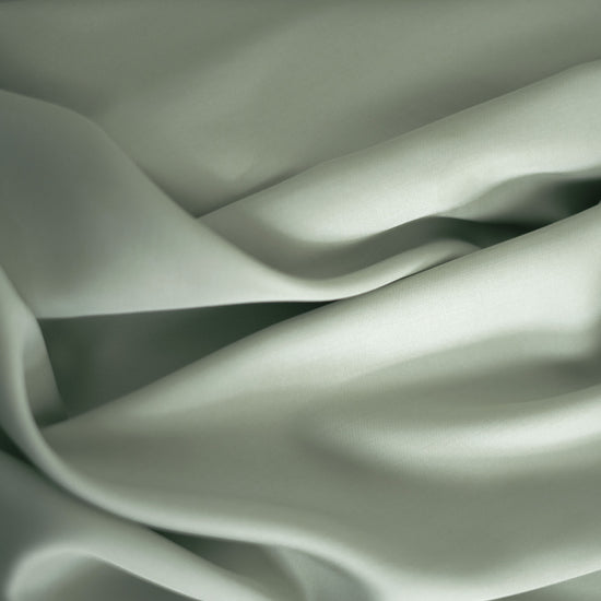 Closeup of green bed sheet