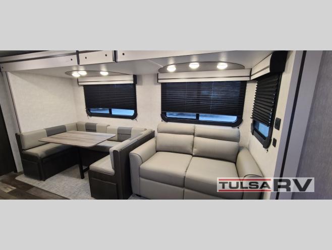 Slide out with a U-shaped dinette and sofa in the CrossRoads cruise air RV