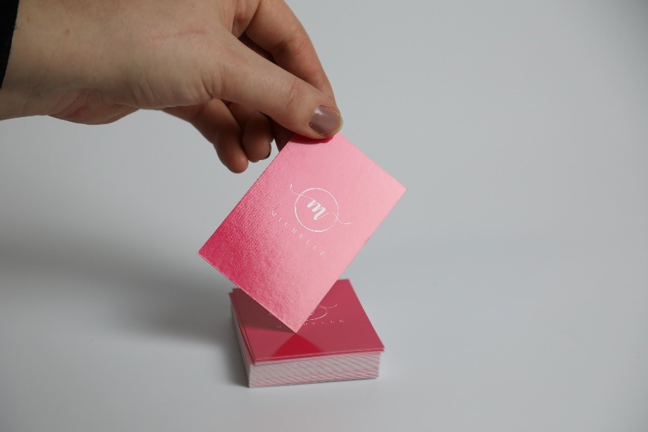 pink business cards with a gloss lamination finish