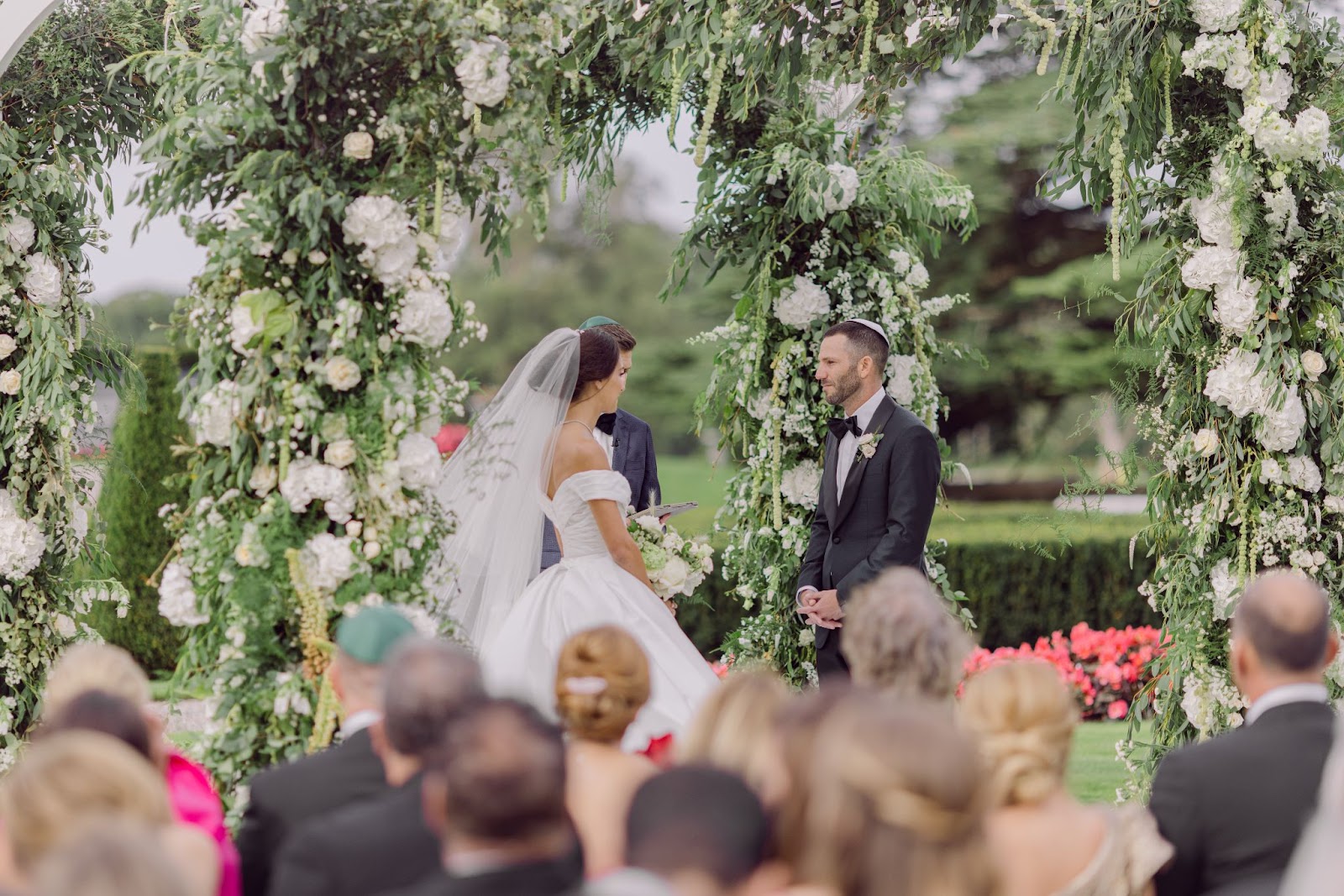 Beautiful couple surrounded by florals by Tara Fay.