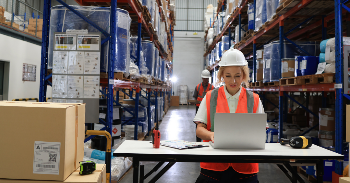 An image capturing a man and a woman engaged in inventory preparation for Amazon Black Friday, organizing and arranging products in a storage area.