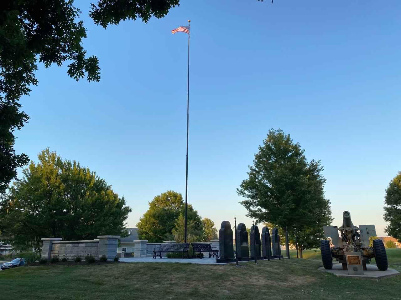 A flagpole in a park

Description automatically generated with low confidence