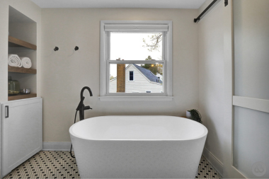 tile flooring in bathroom remodel with tub and window custom built michigan