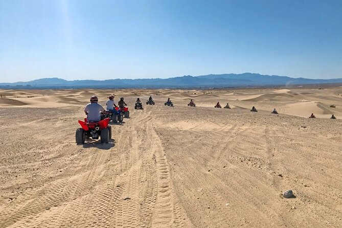 A fleet of ATVs riding through the Mojave Desert