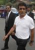 Pakistani cricket umpire Asad Rauf (right) arrives with his lawyer Syed Ali Zafar to address a news conference in Lahore, Pakistan, on Friday. Zafar says Rauf will not be appearing in Indian court over spot-fixing charges as he has no confidence in Mumbai police, who framed charges against the Pakistani umpire. Photo: AP