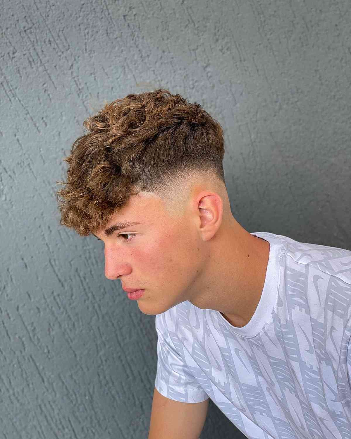 Full picture of a guy rocking the high taper