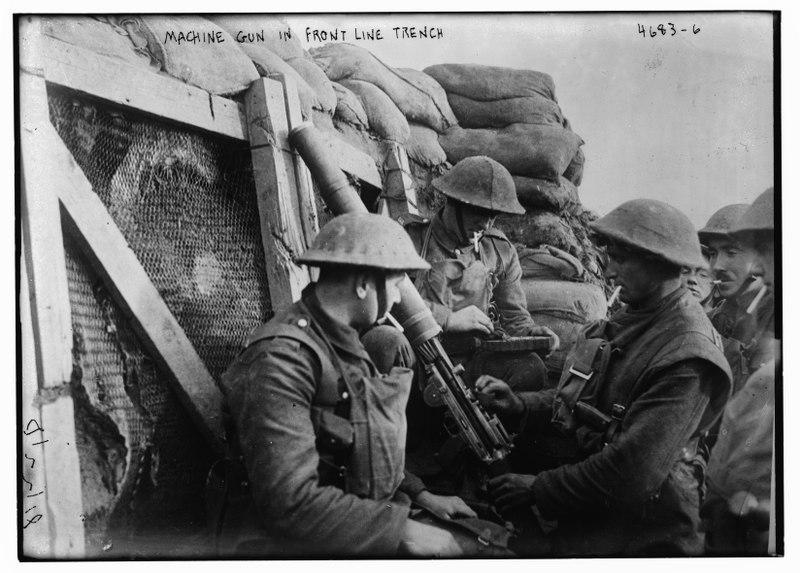 Photograph of soldiers in a trench near a machine gun.