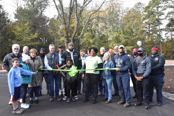 <div class="source">Brian Garner</div><div class="image-desc">GAF Chester Plant Manager Mark McAteer cuts the ribbon on the newly refurbished Wylie Park playground. The ribbon cutting event was followed by a fun day event in the park.</div><div class="buy-pic"></div>