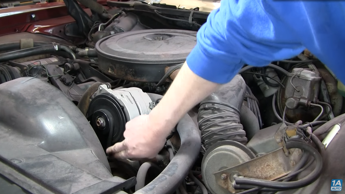 Testing the tension on your drive belt. - Diagnosing Engine Squealing