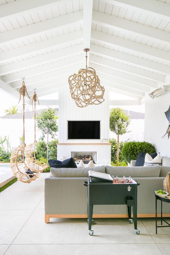 outdoor living room driftwood chandelier white striped sofa atlanta
