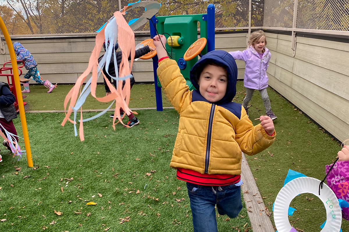 casa child is celebrating día de todos los santos by flying his own kite
