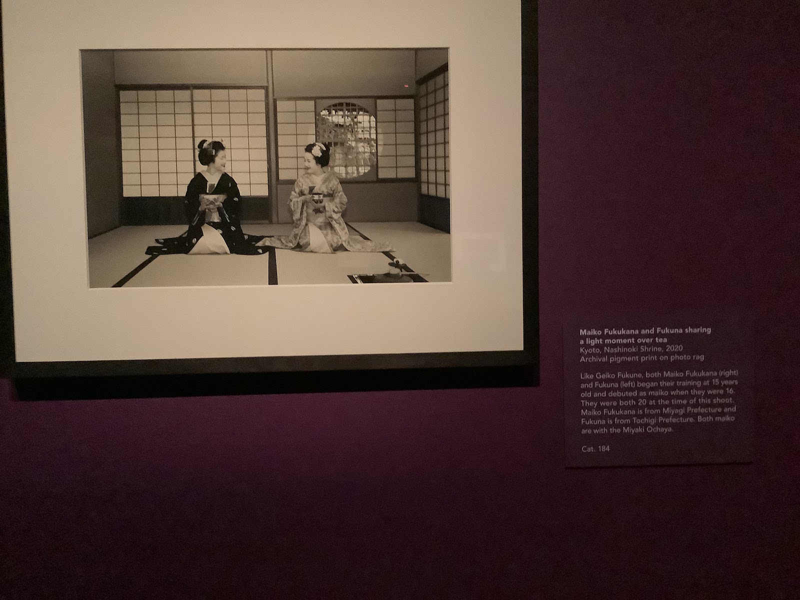 Photograph of Maiko Fukukana and Fukuna sharing a light moment over tea
