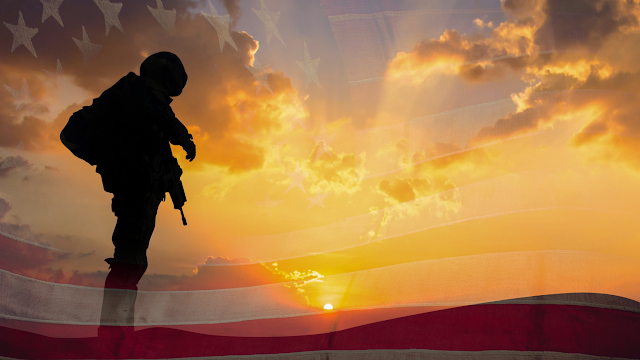 Veteran silhouette with flag in background