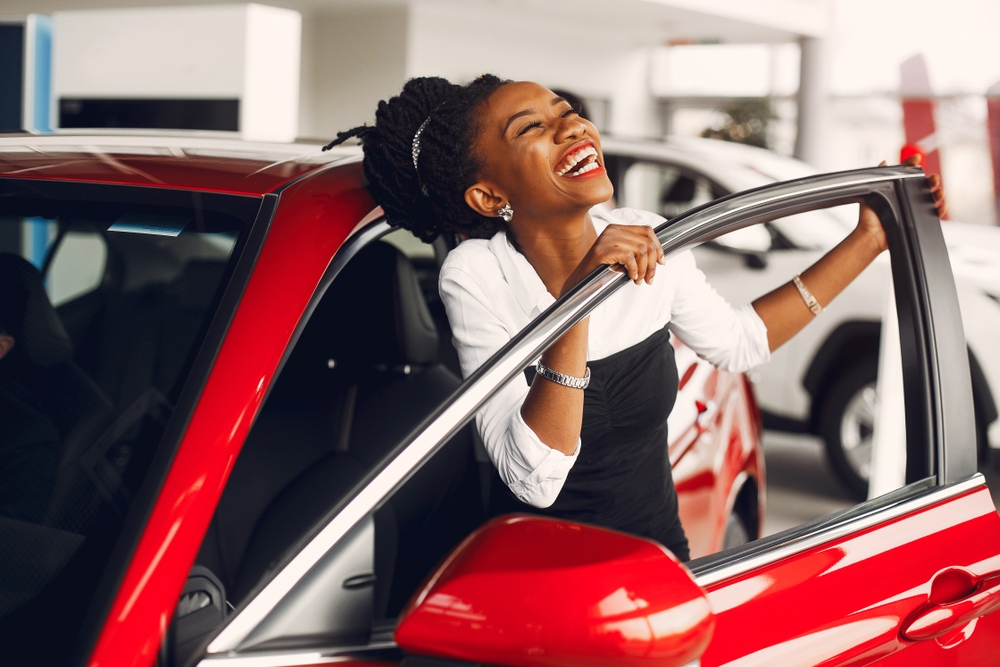 Woman is excited to buy a used car