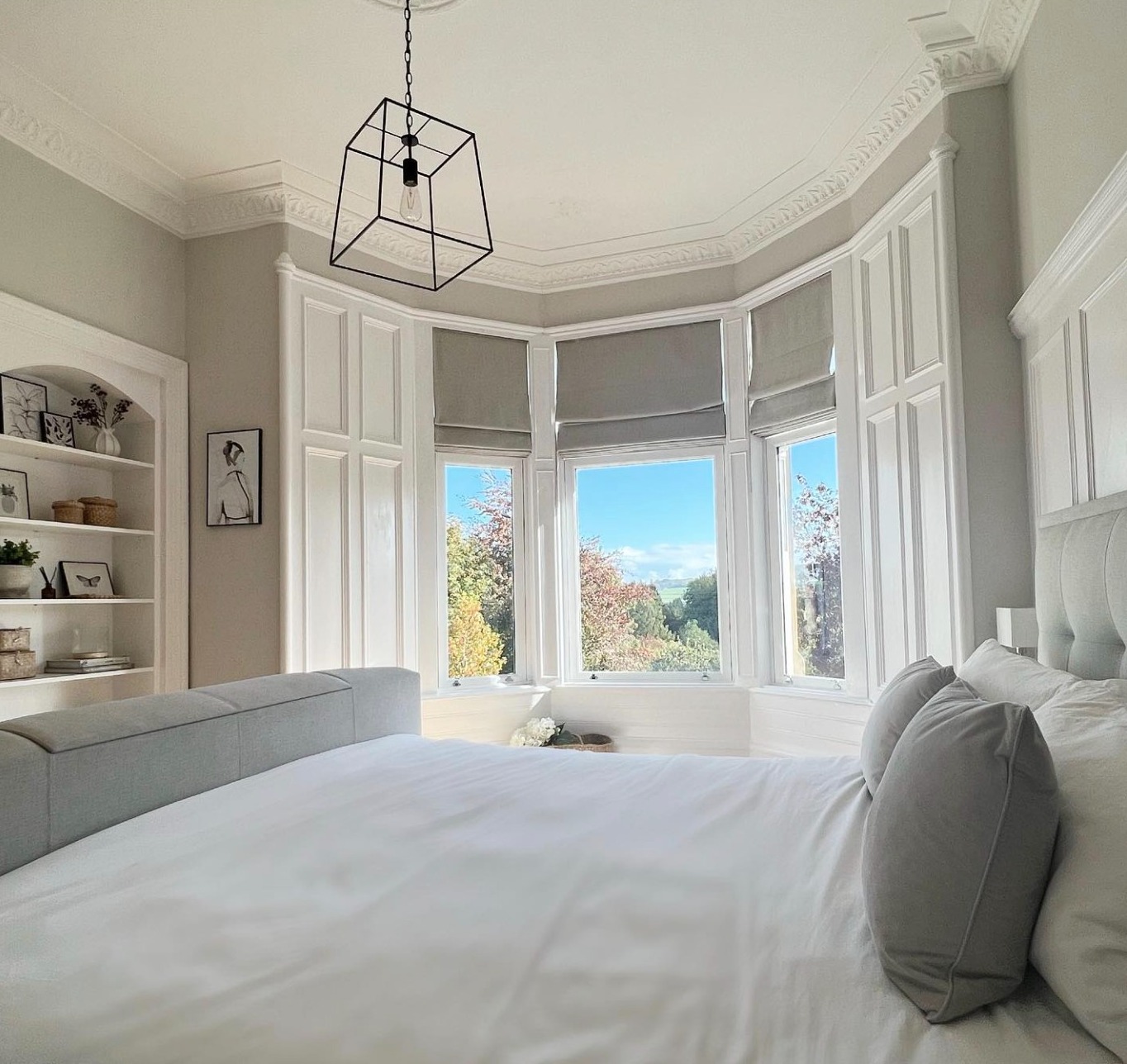 Master bedroom with large bay window painted in Cornforth White
